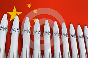 Nuclear missiles in a row and flag of China