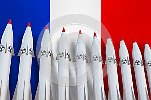 Nuclear missiles in a row and flag of France