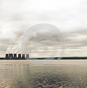 Nuclear power plant on the coast. Ecology disaster concept.