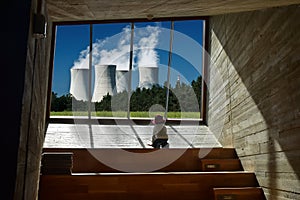 Nuclear power station watched by a child