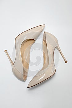 Nude beige high heeled women's shoes. View from above.