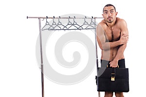 Nude man choosing clothing isolated on white