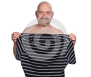 Nude man holding a t-shirt on white background