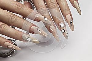 Nude manicure with rhinestones. photo