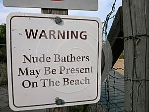 Nude Sunbathers Warning Sign on Beach