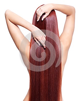Nude woman with long red hair