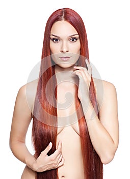 Nude woman with long red hair