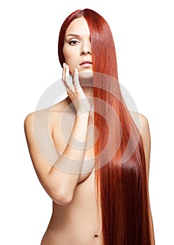 Nude woman with long red hair