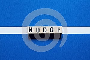 Nudge word concept on cubes