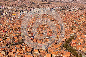 Nuestra Senora de La Paz city with lots of living houses sprawling in the valley with downtown in background, Bolivia