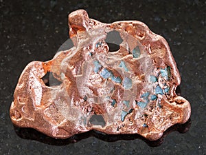 nugget of Native copper stone on dark background