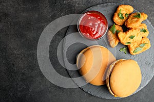 Nuggets, two cheeseburgers and chili sauce
