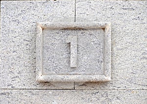 Numbe one, 1, stone relief.