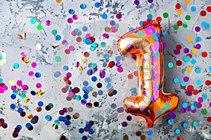 Number 1 happy birthday background. Foil party balloon with confetti and streamers