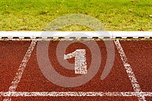 The number 1 at start point of running track or athlete track in stadium