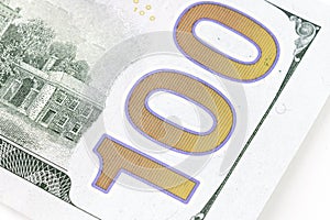Number 100 on 100 dollar bill, fragment of new 100 dollar, part of United states hundred dollars money bill. Dolar USA close up