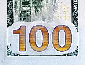 Number 100. Hundred dollars bill fragment closw-up, new edition.