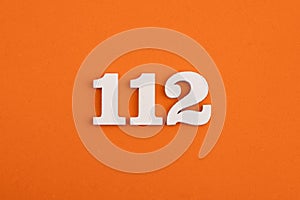 Number 112 - On orange foam rubber background