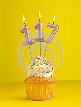 Number 117 candle - Birthday card design in yellow background