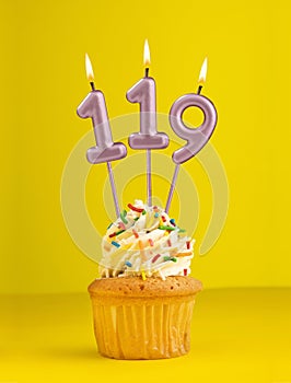 Number 119 candle - Birthday card design in yellow background