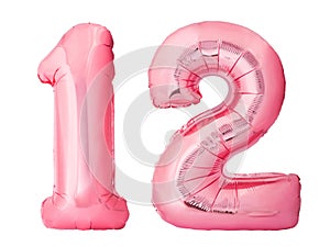 Number 12 twelve made of rose gold inflatable balloons isolated on white background