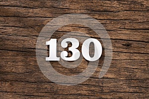 Number 130 - piece on rustic wood background