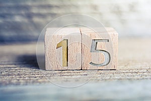 Number 15 Formed By Wooden Blocks On A Board