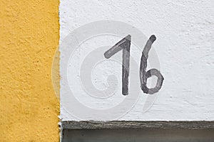 Number 16 painted on wall