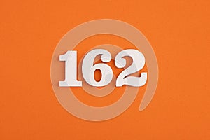 Number 162 - On orange foam rubber background