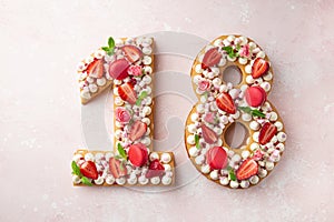 Number 18 naked honey cake for Birthday, pink background