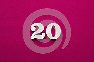 Number 20 - white number in wood on rhodamine red background