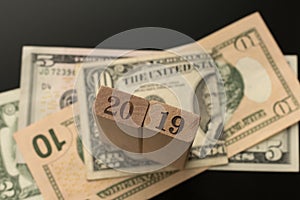 Number 2019 on the dollar banknotes background