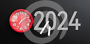 Number 2024 with clock on the blackboard