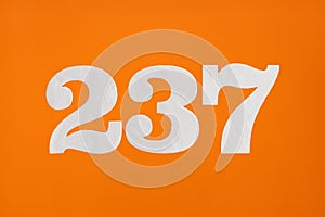 Number 237 - White digits on orange background