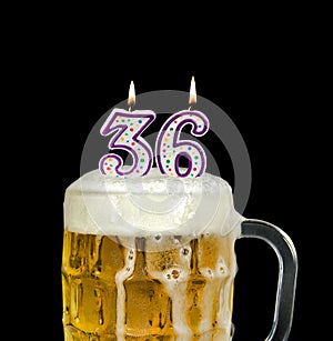 Number 36 candle in beer mug