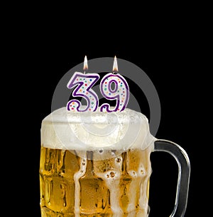 Number 39 candle in beer mug