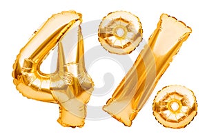 Number 4 four and percent sign made of golden helium inflatable balloons isolated on white. Gold foil numbers for web
