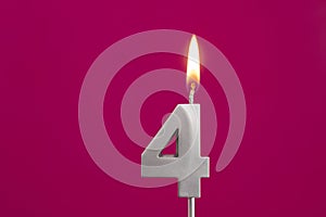 Number 4 - Silver Anniversary Candle on Rhodamine Red Background