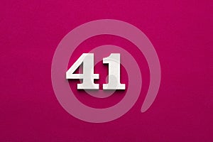 Number 41 - White wooden number on rhodamine red background