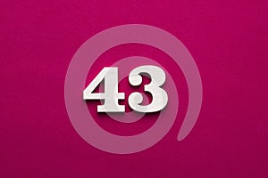 Number 43 - White wooden number on rhodamine red background