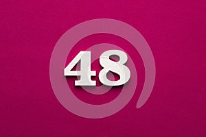 Number 48 - white number in wood on rhodamine red background