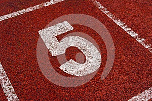 The number 5 at start point of running track or athlete track in stadium