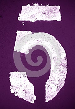 Number 5 in stencil on metal wall in purple tone