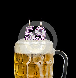 Number 59 candle in beer mug
