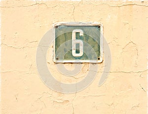 NUmber 6, six, square plate on pink wall.