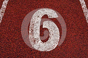The number 6 at start point of running track or athlete track in stadium