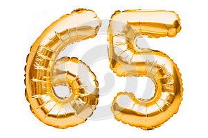 Number 65 sixty five made of golden inflatable balloons isolated on white. Helium balloons, gold foil numbers. Party decoration,