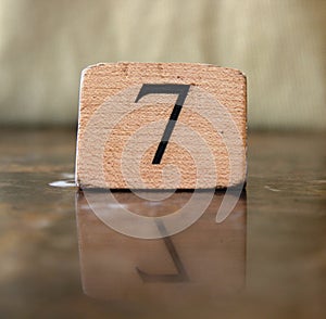 Number 7 sign reflected on table