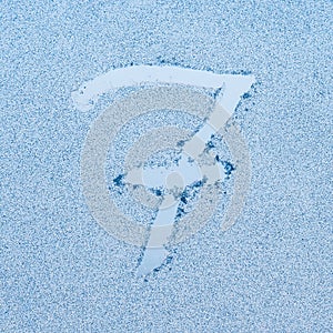Number 7, written on glass with frost in the frost in winter, close up