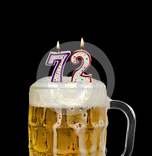 Number 72 candle in beer mug